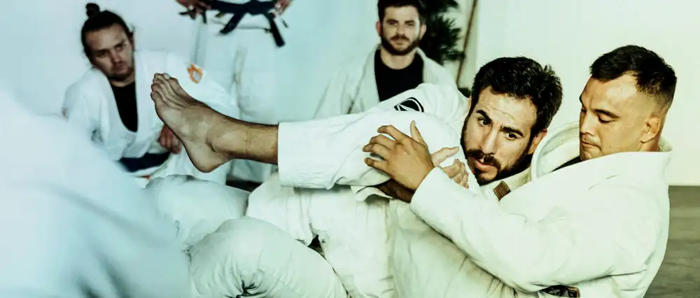 Men in a grappling session at a martial arts gym.