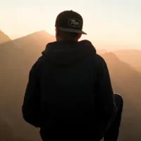 Man on top of mountain.