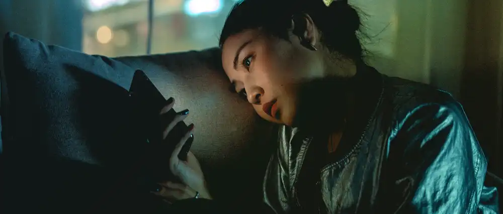 Woman looking at Smart Phone.