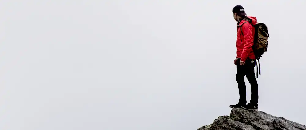Man on top of mountain.